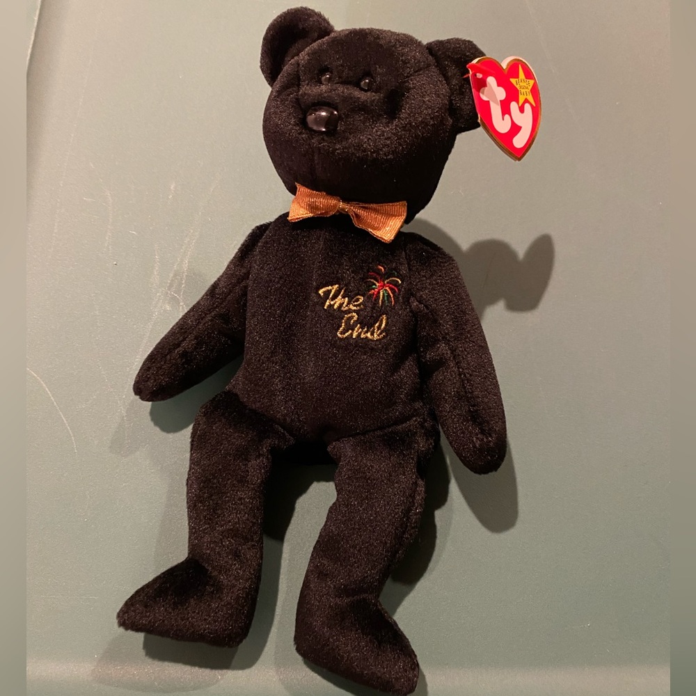 NWT BEANIE BABY - “The End” bear. Kept in collectible case.